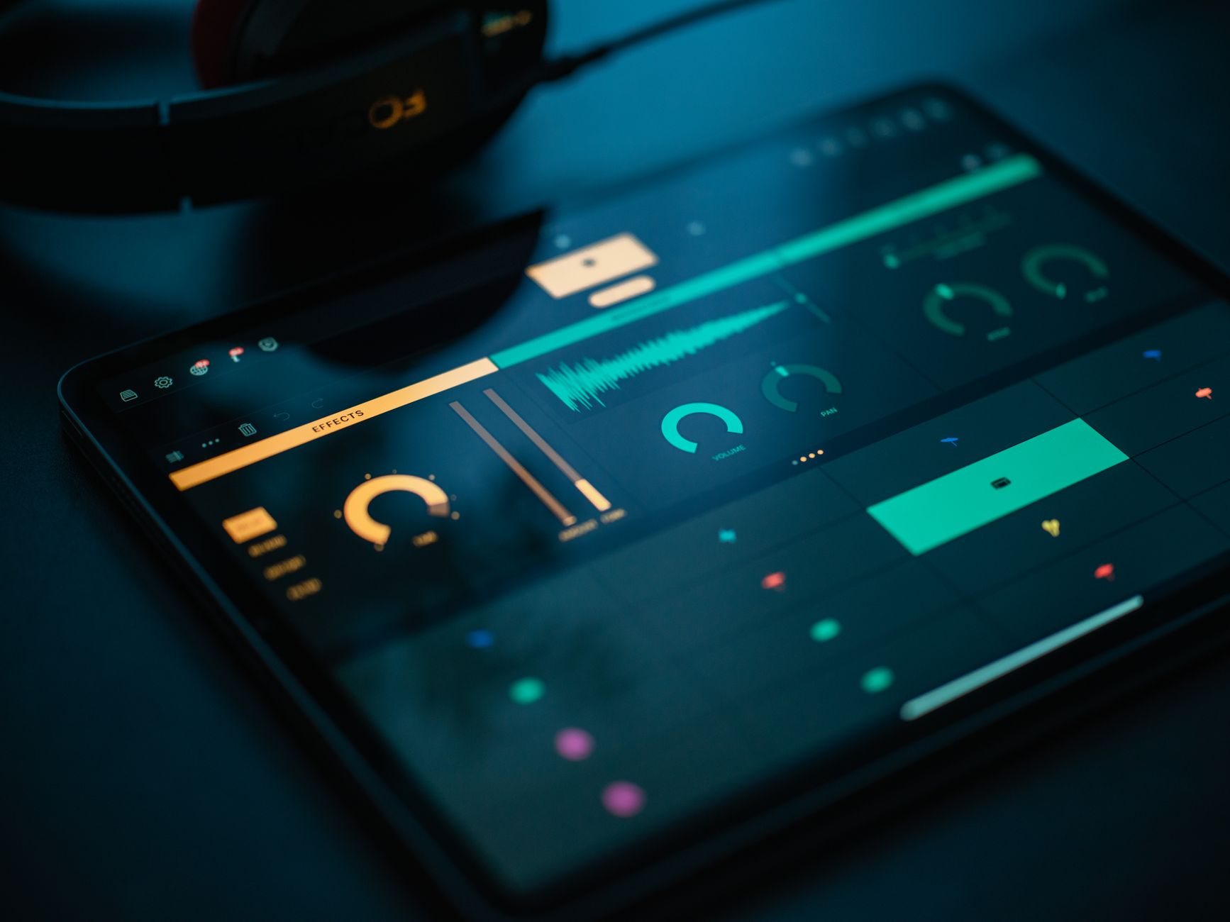 A close-up of a smartphone screen playing a video and showing an audio waveform, representing voice cloning detection.