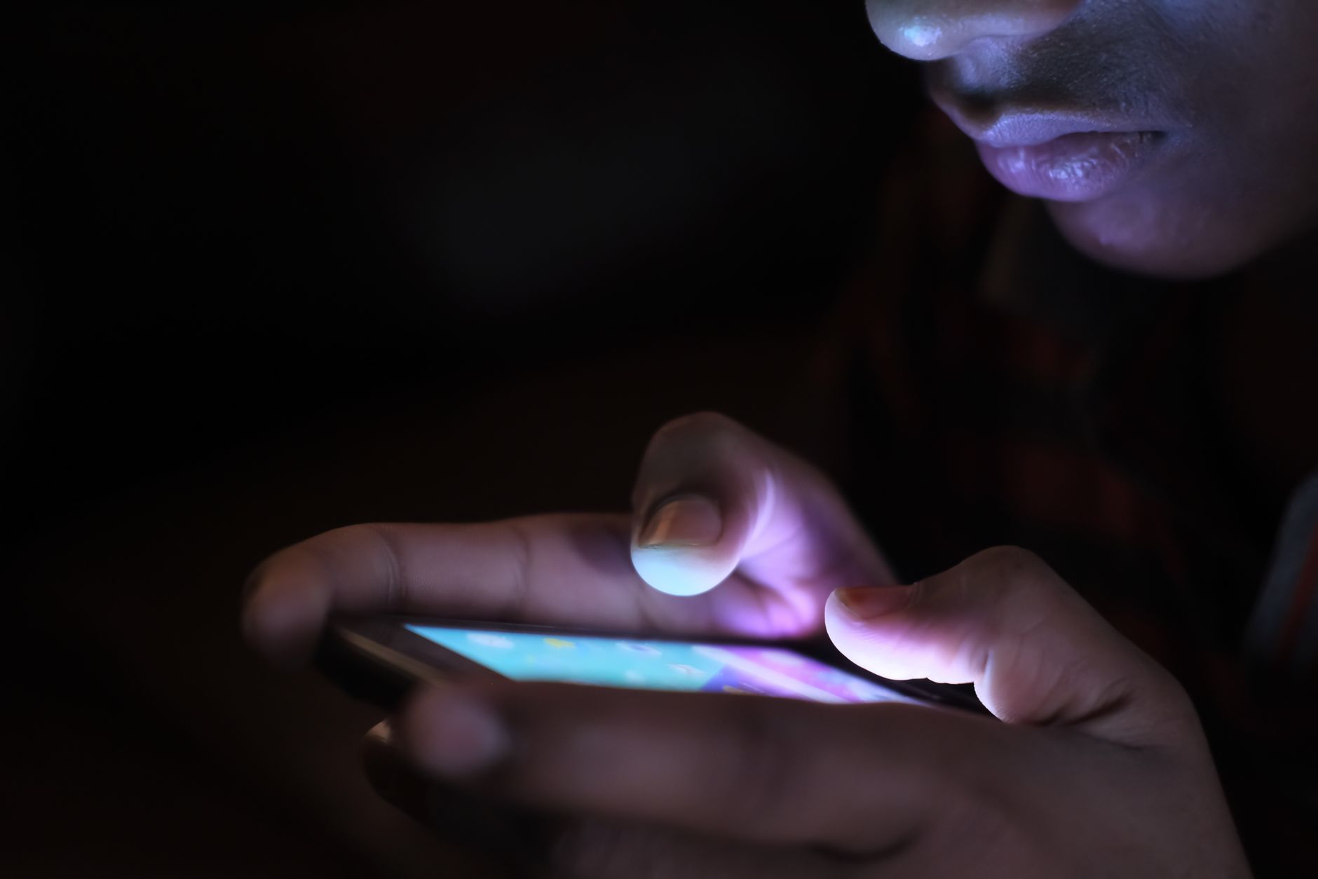 A person taps security settings on a social media app on a smartphone.